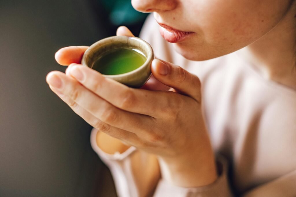 woman drinking green tea