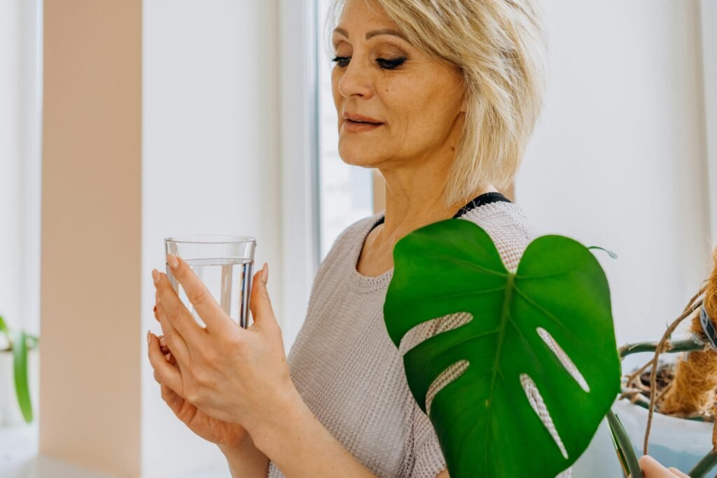 woman over 40 drinking water